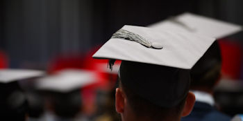 a picture of a student wearing a graduation hat