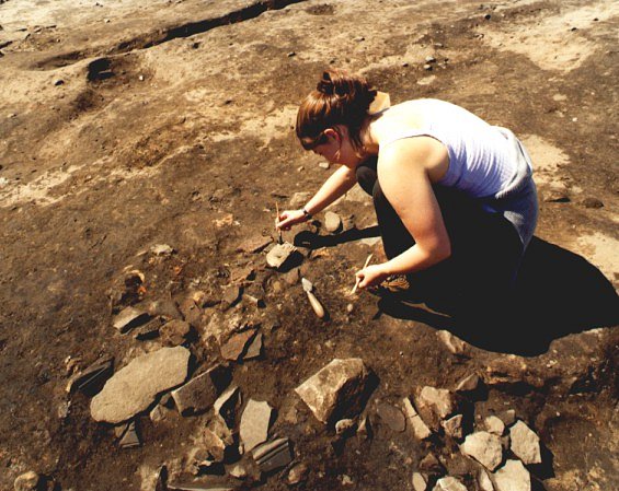 Rebecca Cannel excavating fdragments of sculpture