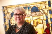 Sarah Brown in front of preserved stained glass (Image: John Houlihan)