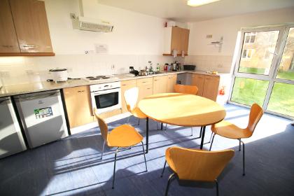 A shared kitchen in Wentworth College. Example room layout. Actual layout and furnishings may vary. 