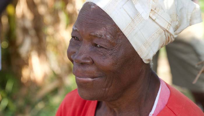 Photo of an older Jamaican woman wearing a headwrap.