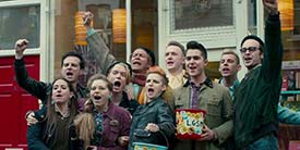 A still from the movie Pride showing a group of gay and lesbian activists supporting the miner's strike.