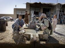 Elderly man and boy using DFID funded water pump in Helmand, Afghanistan