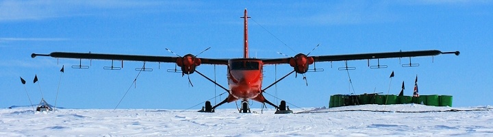 British Antarctic aerogeophysical survey aircraft at Patriot Hills, West Antarctica. Radar antennas used to measure the ice bed morphology visible beneath each wing (Credit: Neil Ross/University of Edinburgh).