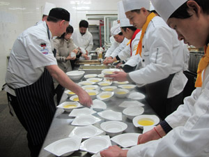 Ian and Andrew prepare a dessert for the English banquet on their last night in Nanjing