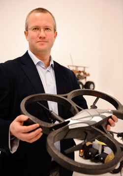Professor Jon Timmis with a flying drone robot. Photo by Ian Martindale