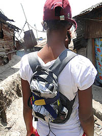 Air quality monitoring in Nairobi - Community member with Dylos backpack