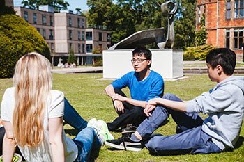 Students sitting in the sunshine