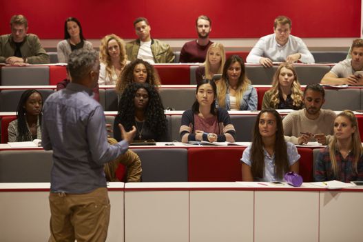 A professor delivering a lecture to a group of students