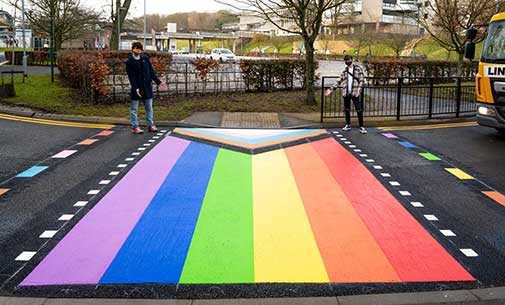 the road crossing in progress pride colours outisde the Spring Lane Building