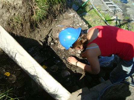 9.) Excavating midden