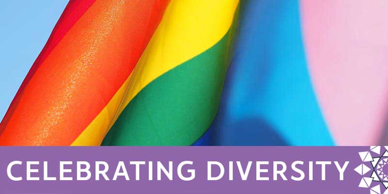 A detail of the Pride rainbow flag with text reading 'Celebrating diversity'.