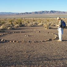 John Schofield recording a modern stone circle at Peace Camp, Nevada. Photo: Harold Drollinger. 