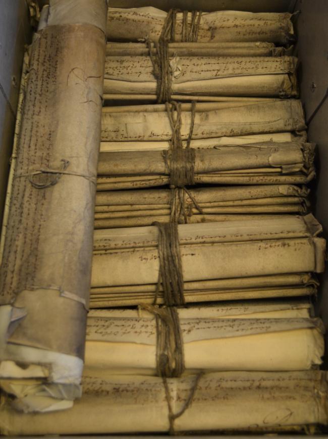 A box of rolled original wills.