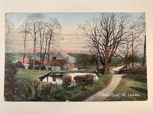 A painting showing a rural scene, with a cottage tucked behind some bare trees, with a pond and hedgerow