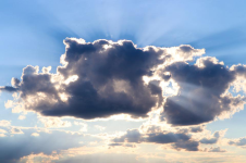 Image of sunlight from behind dark clouds