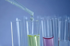 Image of test test tubes filled with colourful liquids and pipette