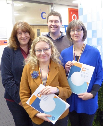 Dr Leonie Jones, Dr Caroline Dessent, Dr Derek Wann and Dr Helen Coombs (clockwise from front) with the Athena SWAN Gold submission document.
