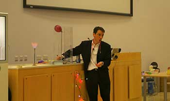 Professor Paul Walton giving a demonstration lecture to students on the chemistry of oxidation and reduction.