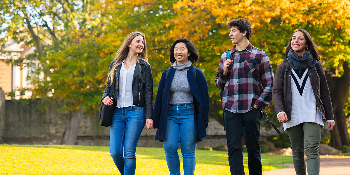 Students walking and talking in a line