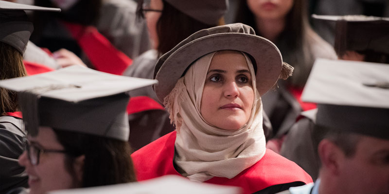 Female PhD student wearing an hijab about to graduate. 
