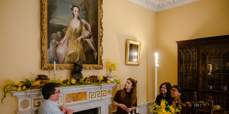 An academic and a group of researchers in Fairfax House, York.