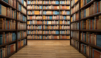 Books stacked on shelves in a library