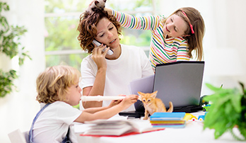 Woman working from home with children