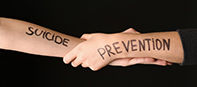 Hands joined with words suicide prevention