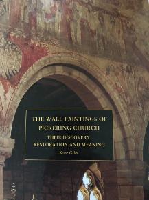 Book cover featuring an image of an archway in a church with paintings on the wall