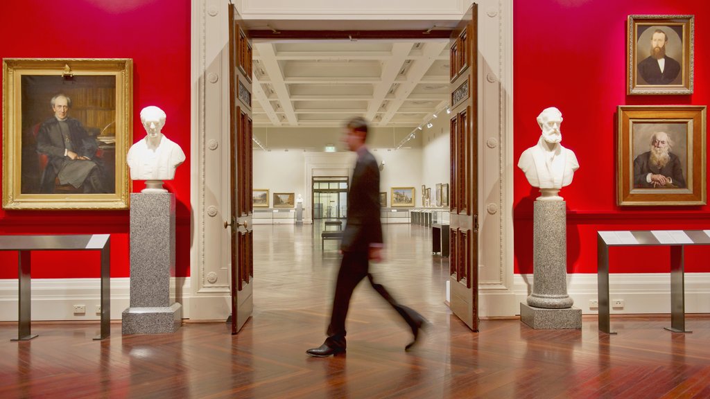 Man walking through an art gallery