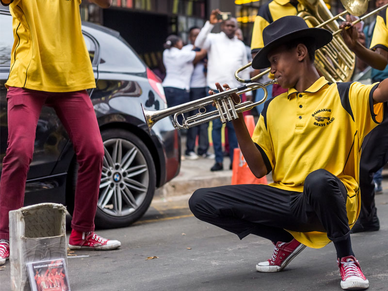 Jazz trumpeter plays in the street