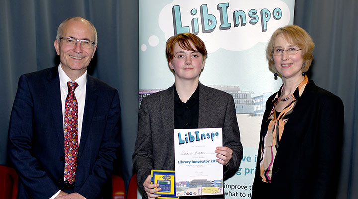 LibInspo 2023 winner Samuel Harris receives the prize from Vice Chancellor Charlie Jeffery and Director of Library, Archives and Learning Services Kirsty Lingstadt.