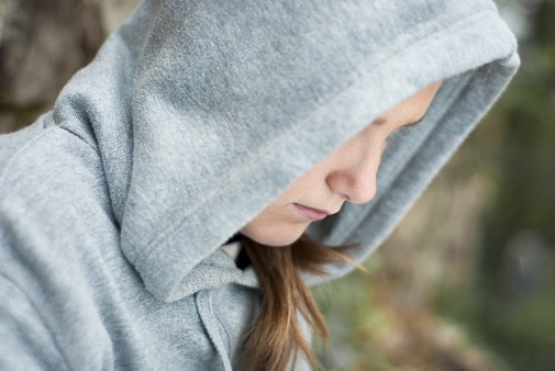 A hooded teenager