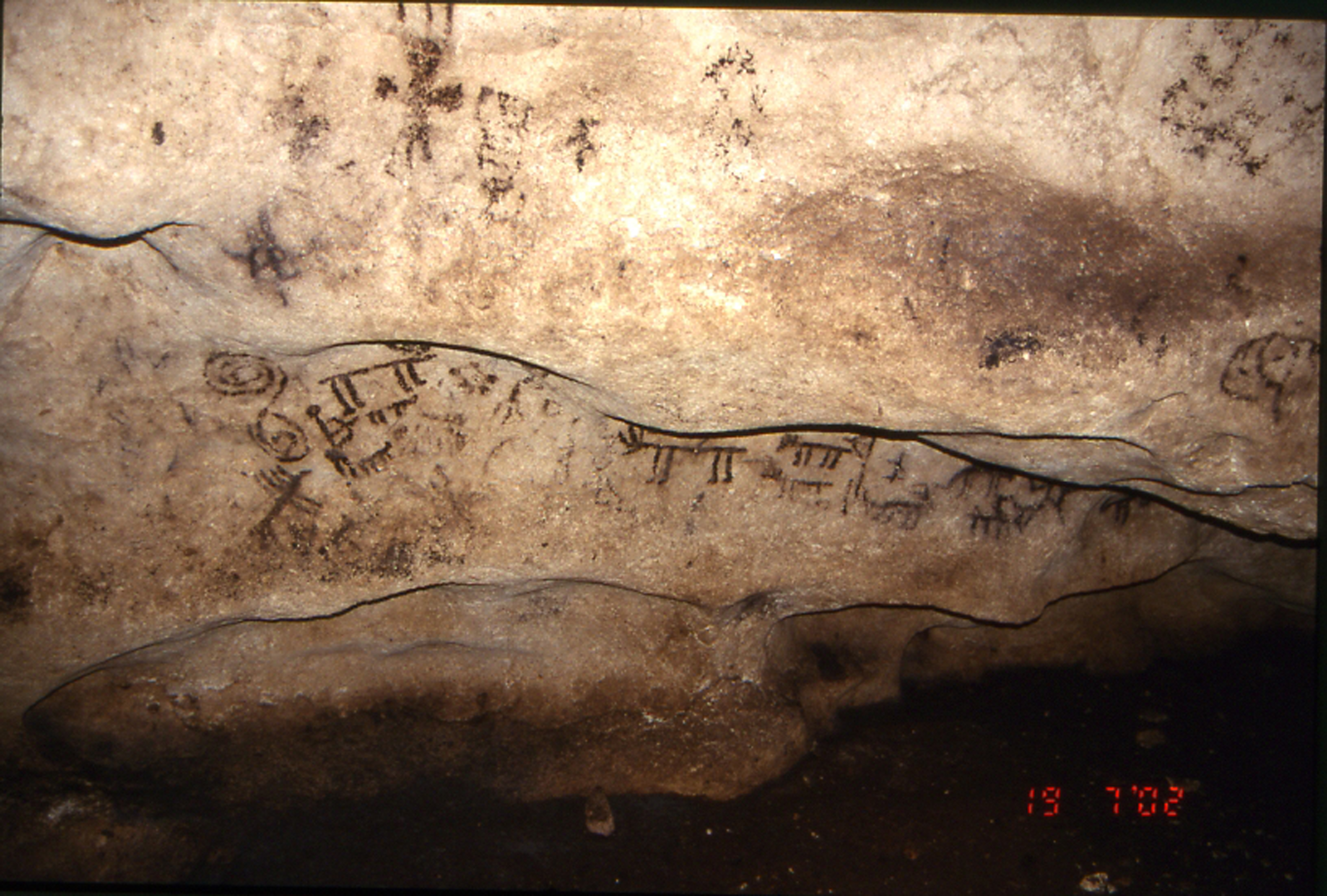 Image: The deer hunting scene (corridor 1, zone 2, and group 8) in the Porto Badisco cave (Otranto, Lecce, Puglia, Italy). General view of cave interior. By permission of the Ministry of Heritage and Culture and Tourism - Superintendence for Archaeological Heritage of Puglia - Stock Photo. (Copyrighted images. Not to be copied or exploited without prior permission)