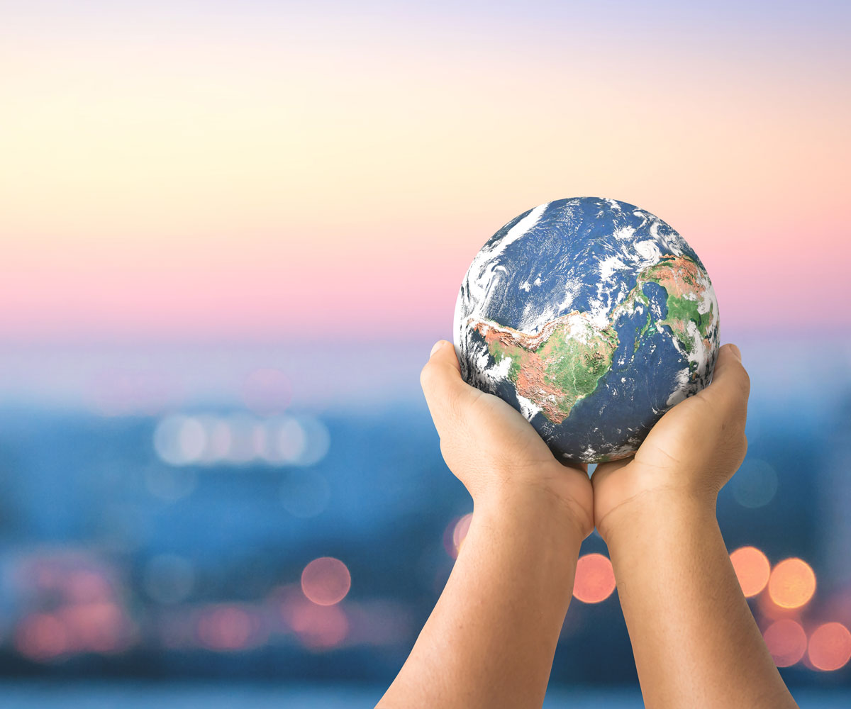 Child holding a small globe.