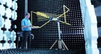 Yellow Bilog antenna in anechoic chamber