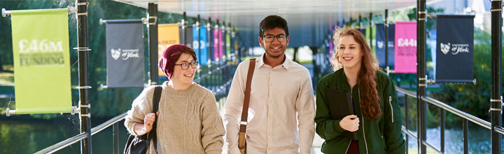 image of students walking across a bridge