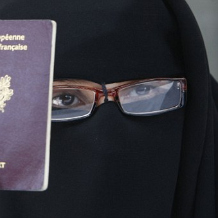 Veiled Muslim woman with her French passport (c) AP