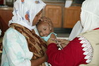Indonesia vaccines health worker. Image provided by World Health Organization (WHO/J. Holmes)