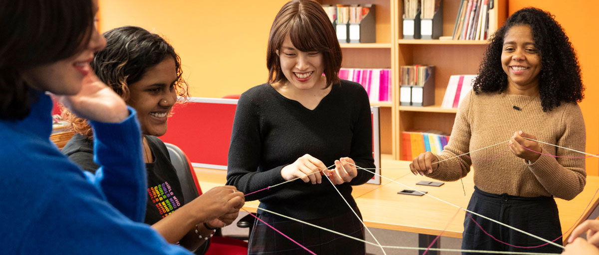 A group of researchers take part in a fun team exercise.