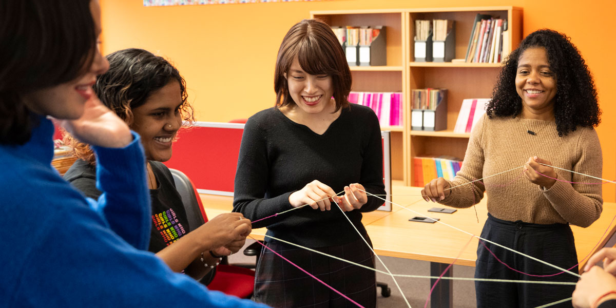 A group of researchers take part in a fun team exercise