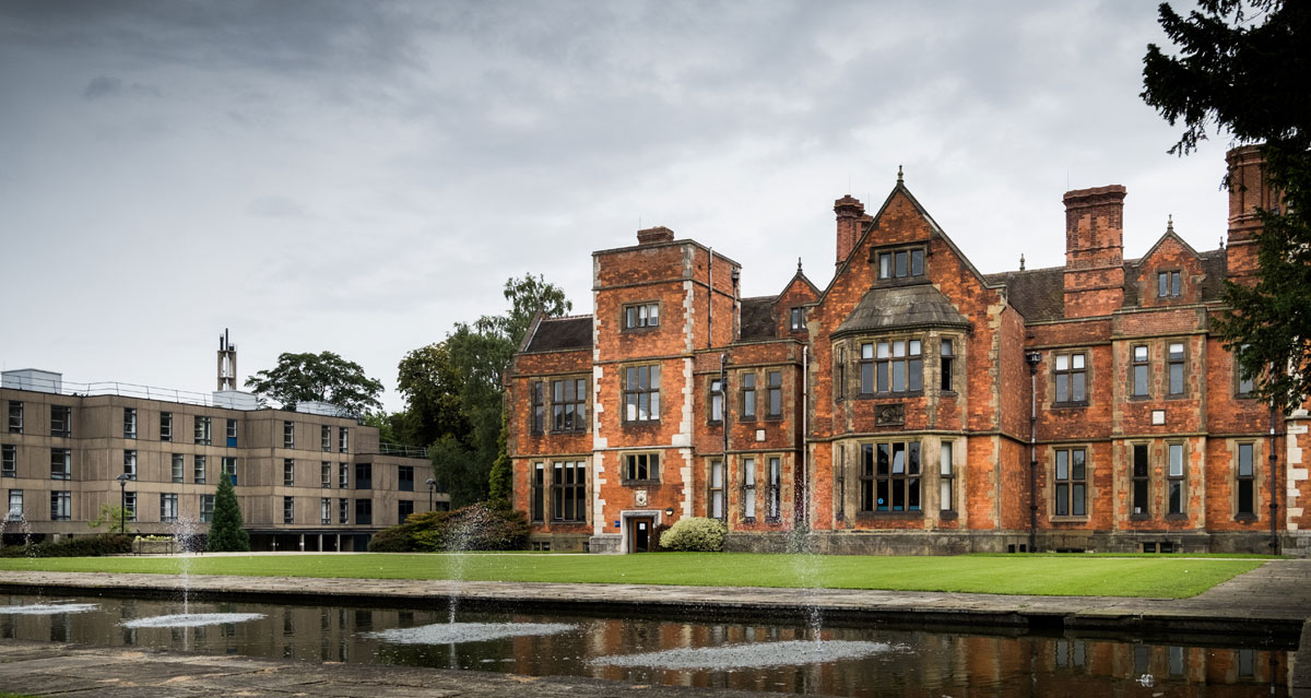The front entrance of Heslington Hall, The University of York, under a grey sky.