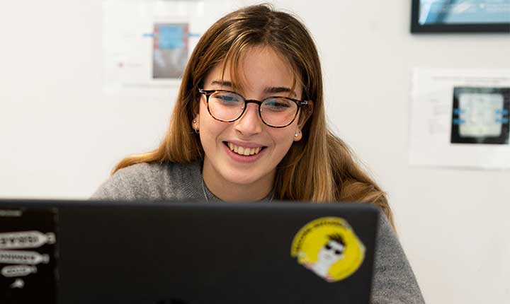 A student working on a laptop