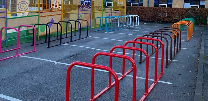 Multi-coloured cycle racks outside the Information Centre.