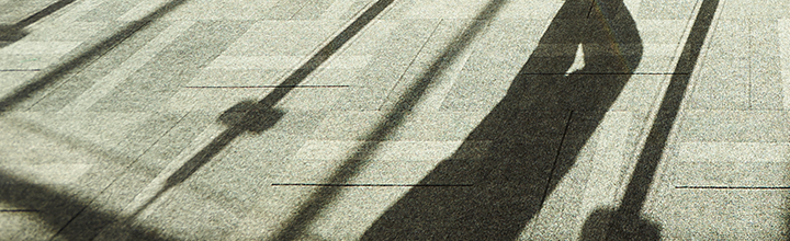 Long shadows across a grey floor.