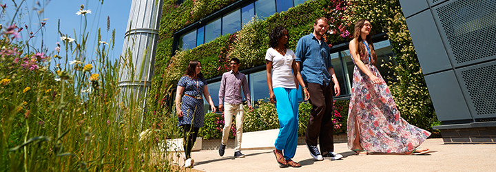 Students walking beside the Living Wall.