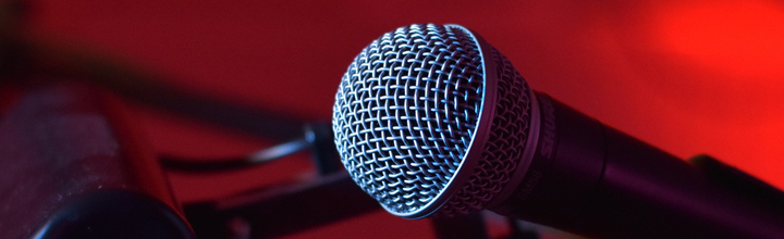 A microphone against a red background