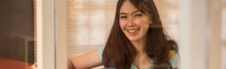 A woman at work smiling.