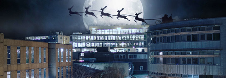Santa and his sleigh are seen in the sky above the Library